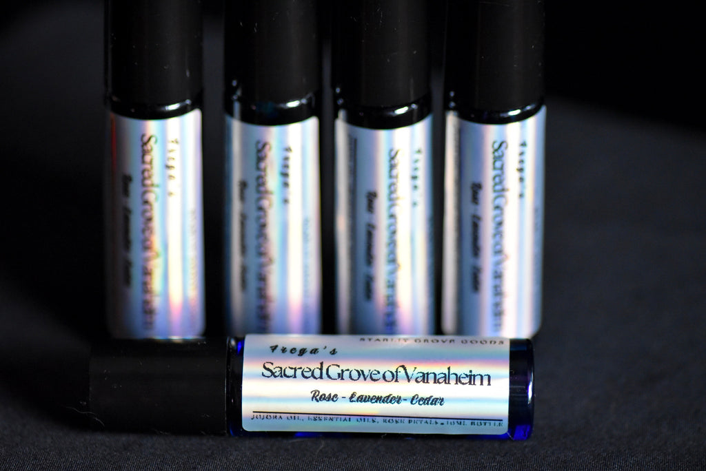 Four small bottles of 'Sacred Grove of Vanahem' essential oil with a fifth bottle in front.