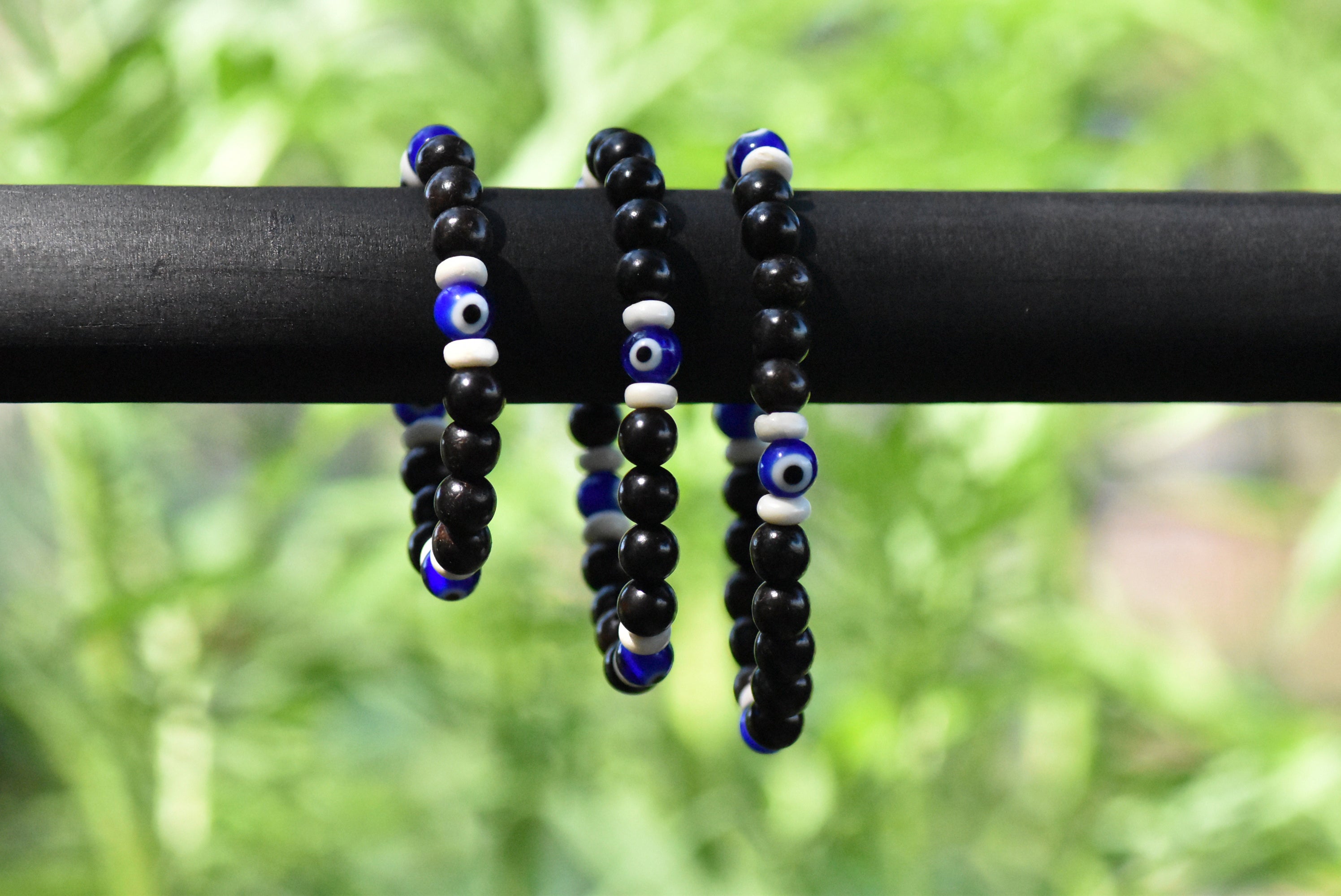 Evil Eyes - Ebony Wood, Ox Bone, and Glass Bracelet